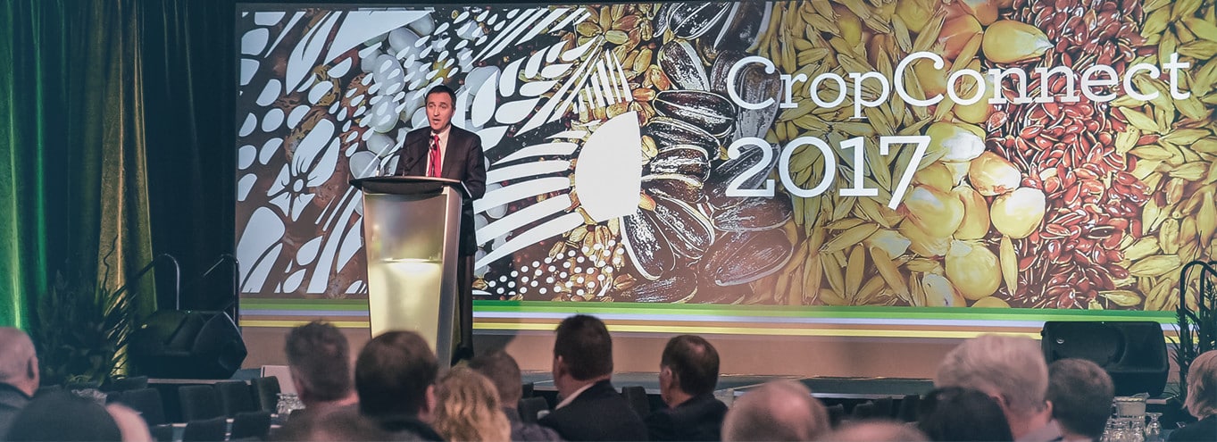 crop-pic-4 A speaker at a podium for a CropConnect 2017 event.